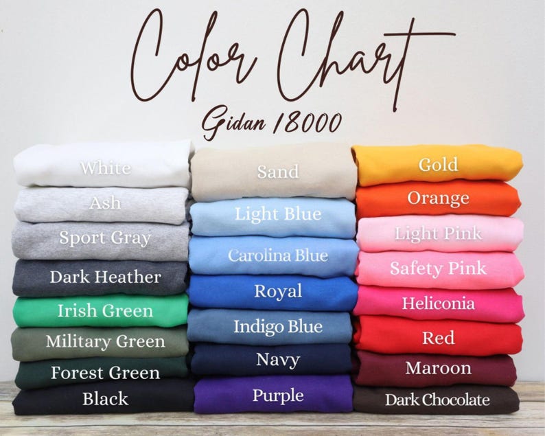 May include: A color chart displays a variety of sweatshirt colors, including white, black, and shades of blue, green, and pink. The text "Color Chart" and "Gidan 18000" are visible. The sweatshirts are neatly stacked.