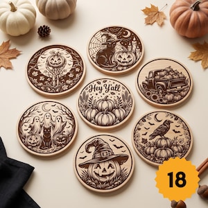 May include: Seven round wooden coasters featuring dark brown laser-engraved Halloween designs including a cat with a witch hat, a truck with pumpkins, ghosts, a raven, and a central coaster with the text Hey Y'all surrounded by pumpkins.