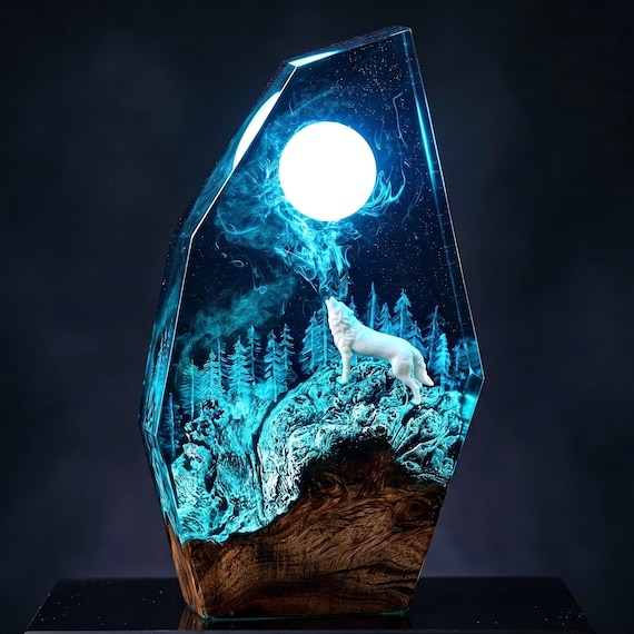 A glowing wolf howling at the moon inside a handcrafted resin diorama — legitimately atmospheric fantasy table art with respectable demand.