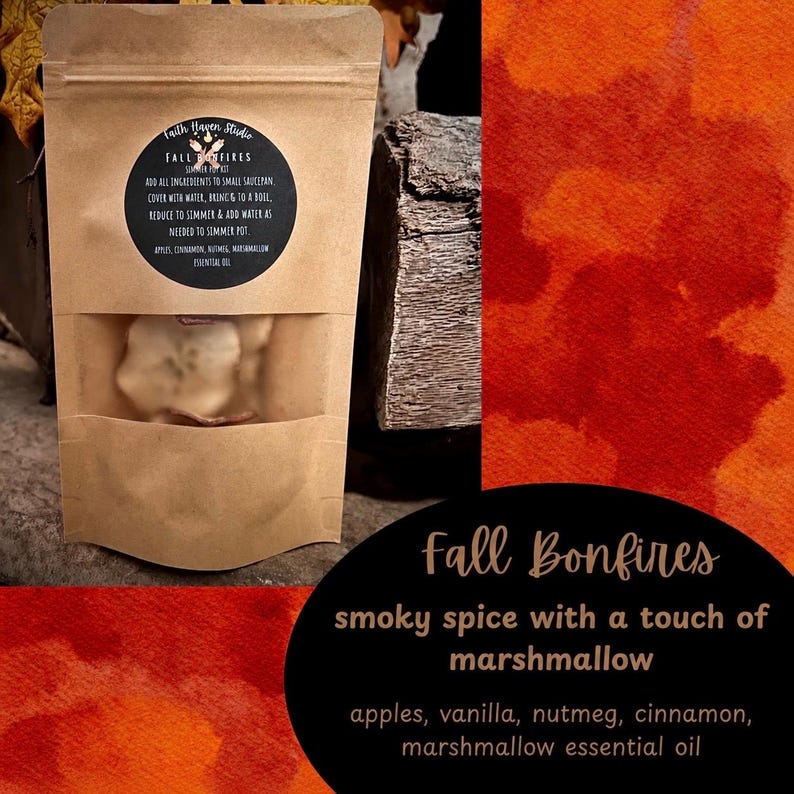 May include: A brown kraft paper pouch containing a simmer pot kit labeled Fall Bonfires. The circular label lists ingredients including apples, cinnamon, nutmeg, and marshmallow essential oil, with instructions to simmer in a small saucepan.