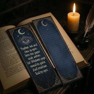 May include: Two dark blue bookmarks with gold accents and a crescent moon design. One bookmark features an eye illustration and text that reads "Feather, ink and time to spin, Into this paper soak within, Let Wisdom's page reveal its guise. And intuition lead ny eyes."