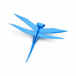 May include: A vibrant blue origami dragonfly, crafted from folded paper. The dragonfly features delicate wings and a slender body, showcasing the art of paper folding. The wings are spread, and the dragonfly is set against a white background.