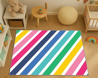 May include: A rectangular rug with a vibrant diagonal stripe pattern in shades of yellow, pink, blue, green, and white. The rug is placed on a wooden floor in a child's room, with other toys and furniture visible in the background.