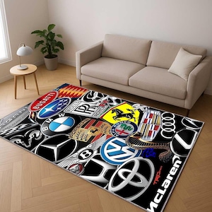 May include: A rectangular rug displaying a collection of car brand emblems, such as Bugatti, BMW, Porsche, and Rolls Royce, set against a black backdrop. The rug is positioned on a wooden floor, with a beige sofa and side table visible.