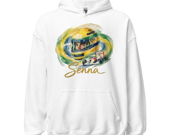 Puede incluir: Sudadera con capucha blanca con un gráfico colorido de un casco y un coche de carreras, con el nombre "Senna" en letras doradas. El casco es amarillo y verde, sobre un fondo arremolinado de verde, amarillo y azul. Un diseño clásico para los fanáticos de las carreras.