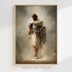 May include: A wall art print featuring a bearded figure in metallic armor and a light-colored cloak, holding a large shield and standing in a misty, neutral-toned environment. The text "PRINTS AND PEACE" is printed at the bottom of the image.