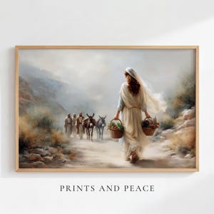 May include: A framed wall art print depicting a person in a light-colored robe walking away on a dusty path, carrying two woven baskets filled with produce. In the distance, three figures walk alongside two donkeys. The text PRINTS AND PEACE is below.
