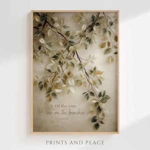 May include: A framed art print featuring a botanical illustration of tree branches with green and off-white leaves. The print includes the text "I AM the vine. You are the branches" and "John 15:5". The words "PRINTS AND PEACE" are at the bottom.