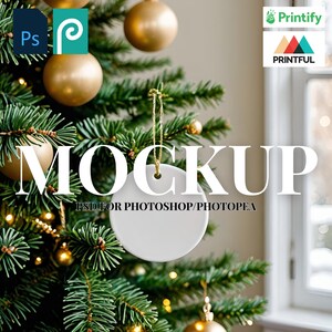 May include: A white ceramic Christmas ornament mockup hanging on a decorated Christmas tree. The word "MOCKUP" is displayed in large white letters, with "PSD FOR PHOTOSHOP/PHOTOPAE" below. Gold ornaments and a Printify logo are also visible.