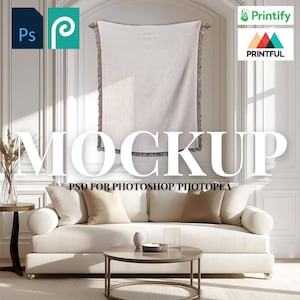 May include: A mockup image featuring a cream-colored woven blanket with fringed edges hanging on a wall. A white sofa with beige pillows, a round coffee table, and a rug are in the foreground. The word "MOCKUP" is displayed prominently.