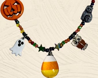 Sweet Candy Corn pendent with Charms and Hand decorated Beads decorate this Necklace
