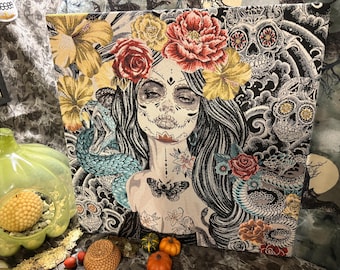 Day of the Dead tapestry panel stretched on a wood frame featuring a young women in traditional makeup and costume