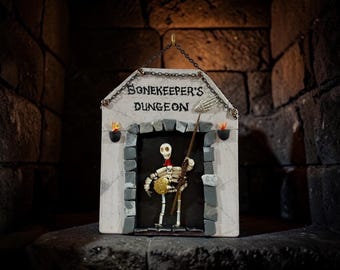 The Bonekeepers Dungeon wall plaque with Glow in the Dark elements!