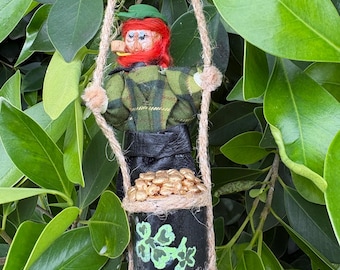 Caught! A mischievous leprechaun with his pot of gold!