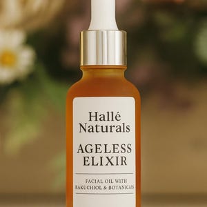 May include: Amber-colored glass bottle of facial oil with a white dropper and silver cap. The label reads "Hallé Naturals AGeless Elixir Facial Oil with Bakuchiol & Botanicals."