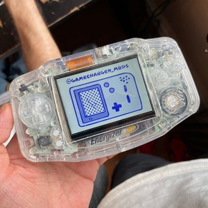 Custom Modded Gameboy Advance IPS backlight with new buttons, shell, glass screen lens. Free Game!