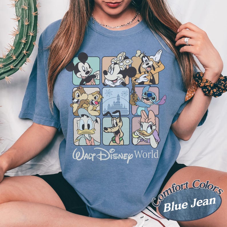 May include: Blue jean colored t-shirt featuring a grid of Disney characters including Mickey Mouse, Minnie Mouse, Goofy, Chip and Dale, Stitch, Donald Duck, Pluto, and Daisy Duck. The words "Walt Disney World" are printed below the grid.