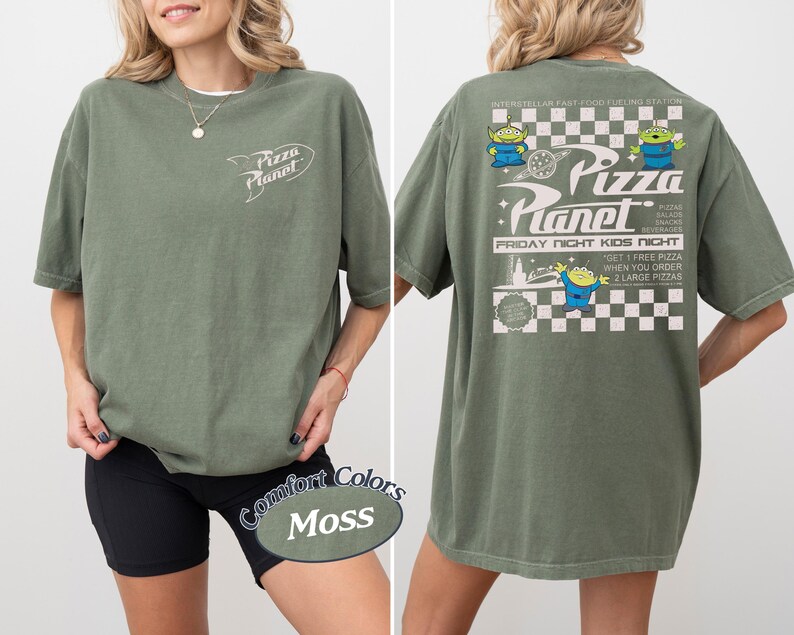 May include: Moss green t-shirt with the Pizza Planet logo on the front and back. The back features the Pizza Planet logo, alien characters, and text that reads "Friday Night Kids Night".