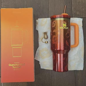 May include: A set of three ceramic mugs with a speckled, matte finish. The mugs are in shades of cream, light gray, and dark gray. Each mug has a simple, minimalist design, perfect for coffee or tea.