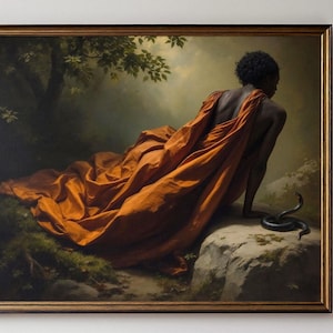 May include: A framed artwork depicts a person draped in orange fabric, seated near a snake on a rock. The painting has a dark, naturalistic background with trees and foliage. The artwork is signed "EFFUE".