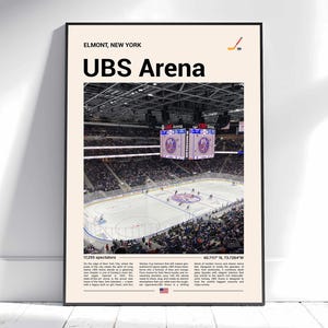 May include: A framed poster featuring the UBS Arena in Elmont, New York. The image shows the hockey rink with spectators. Text includes "UBS Arena", "17,255 spectators", and coordinates. A hockey stick graphic is in the upper right corner.
