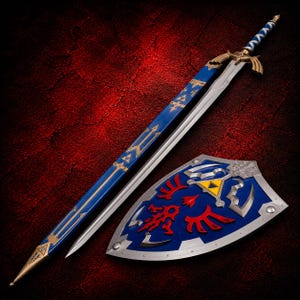 May include: A long sword with a silver blade, a blue and gold hilt, and a blue scabbard featuring gold accents and a triangular emblem. Beside it lies a blue shield with a silver border, a central yellow triangle, and red wing-like designs.