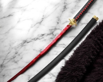 May include: A katana sword with a red blade and black handle, resting on a marble surface. The handle is wrapped in black with red diamond accents. The scabbard is black with gold accents.