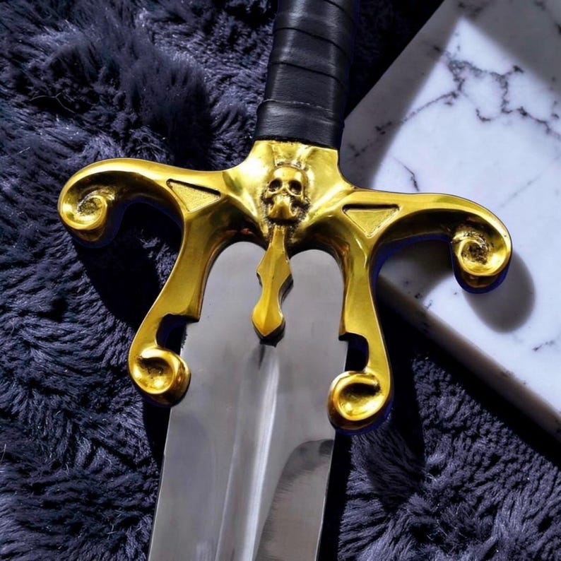 May include: A set of three ceramic mugs with a speckled, matte finish. Each mug features a different color: light blue, cream, and gray. The mugs have a simple, modern design with a rounded shape and a comfortable handle.