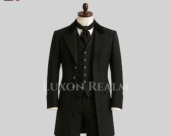 May include: A black formal suit displayed on a mannequin. The suit includes a long coat, vest, and trousers. The coat has a velvet collar and the vest has a patterned design. The text "LUXON REALM" is visible on the suit.