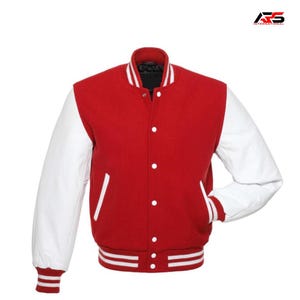 May include: A red and white varsity jacket with a button-up front. The jacket features white sleeves, a red body, and white and red striped detailing on the cuffs and hem. The collar is white with two stripes.