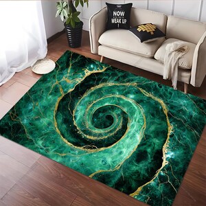 May include: A rectangular area rug with a swirling, spiral design. The rug features a vibrant green and gold color scheme, with a marble-like pattern. The design includes a central spiral and gold vein-like accents.