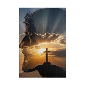 May include: A vertical rectangular wall art print featuring a double exposure silhouette of a bearded figure wearing a crown of thorns, overlaid with a sunset landscape showing a dark hill and a Christian cross against a bright golden sky.