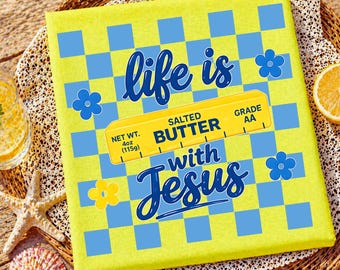 May include: A yellow canvas print with a blue and yellow checkered pattern and the words "life is with Jesus." A yellow butter stick graphic reads "Salted Butter, Net Wt. 4oz (115g), Grade AA."