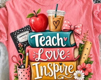 May include: A coral-colored t-shirt featuring a graphic print of three stacked books labeled Teach, Love, and Inspire. The design includes a red apple, a coffee cup, a pink polka-dot bow, a black composition notebook, scissors, and a yellow pencil.