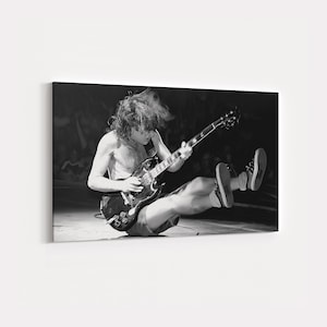 Angus Young AC/DC Canvas Art: Rock Legend Guitar Performance