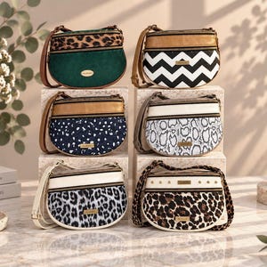May include: Six semi-circular crossbody bags arranged in two stacks. The bags feature various patterns including leopard print, solid green corduroy, black and white chevron, navy blue with white speckles, snakeskin, and a white leopard print design.