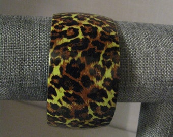 Bracelet Bangle Cuff Animal Print Light Yellow Back Ground Black and Brown Print Acrylic Plastic 1 3/4 Inches Wide Fits 8 Inch Wrist 1990