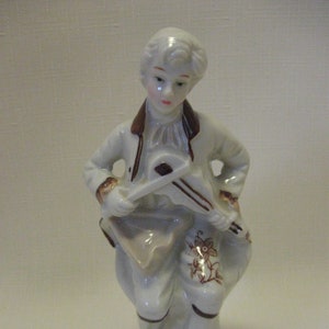 Figurine Porcelain Colonial Siting  Man Holding Mandolin Brown Flower And Leaf Print On White 6 1/4&quot; Tall