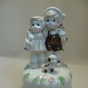 Ceramic Porcelain Wind Up Music Box Little Boy Girl Puppy Figurines White Browns Pink and Greens Colors 1960