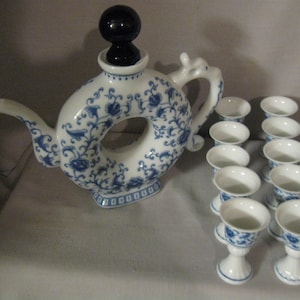 Tea Pot Set Donut Hole 10 Dainty Saki Cups Delft Style Blue and White Floral Flowers and Leaves Style Dragon Handle Cobalt Blue Stopper
