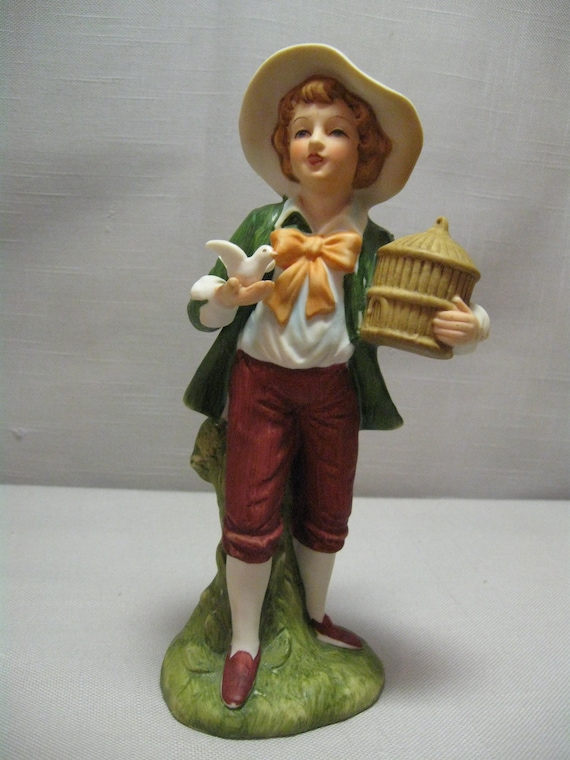 Figurine Bisque Porcelain Boy Holding White Dove and Bird Cage