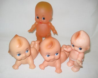 Kewpie Baby Dolls Qty of 4 Laying Down Diaper Baby Movable Parts Blue Eyes Figurine