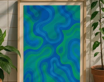May include: Abstract art print in a wooden frame. The artwork features a flowing design in shades of blue and green. The framed art is displayed against a white tiled wall, with potted plants on either side.