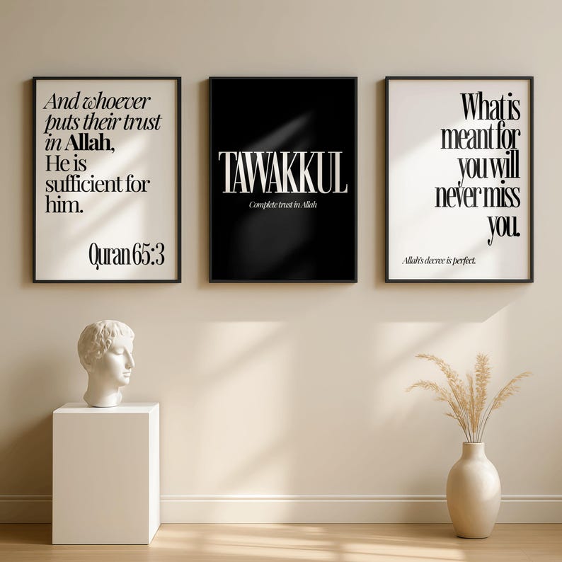May include: Three framed wall art prints with black frames. The prints feature inspirational quotes in white text on black and white backgrounds. A white bust sculpture sits on a white pedestal. A vase with dried plants is on the floor.