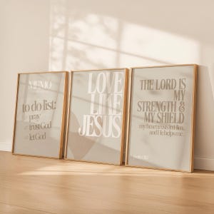 May include: Three framed prints with inspirational quotes. The first print reads "MEMO to do list: pray, trust God, let God." The second print says "LOVE LIKE JESUS." The third print reads "THE LORD IS MY STRENGTH & MY SHIELD."