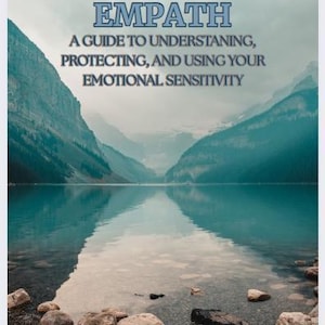 May include: A book cover with the title "THE EMPOWERED EMPATH" in blue letters. The cover features a scenic landscape with mountains, a lake, and the text "A GUIDE TO UNDERSTANDING, PROTECTING, AND USING YOUR EMOTIONAL SENSITIVITY."