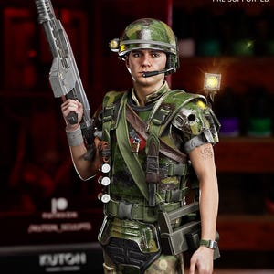 May include: A detailed figurine of a soldier in a camouflage uniform, holding a futuristic rifle. The figure wears a helmet with a light and a headset. The text "KUTON" is visible at the top left. The text "Lychee Slicer PRE-SUPPORTED" is at the top right.