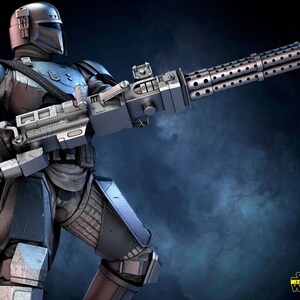 May include: A detailed digital rendering of a futuristic armored figure, clad in metallic gray and blue armor, holding a large, silver, multi-barreled weapon. The figure is posed dynamically against a dark, smoky background, with the Star Wars 3D Models logo in the lower right corner.