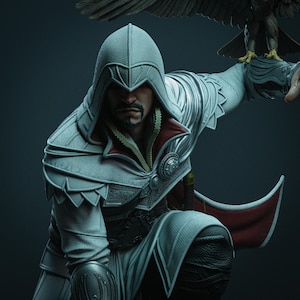 May include: A detailed figurine of a character in a white and silver hooded outfit, kneeling with a red-lined cape. An eagle perches on the character's arm. The figure has a serious expression, set against a dark background.