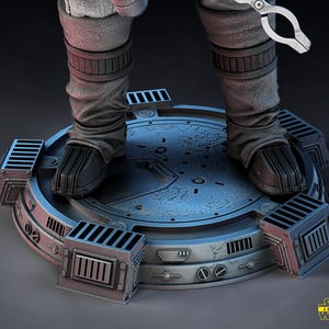 May include: A detailed 3D model of a figure's legs and feet, clad in gray boots and pants, standing on a metallic platform. The platform has a circular design with rectangular vents and a textured surface. The Star Wars logo is visible.
